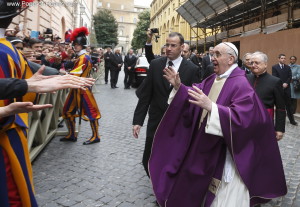 Pope Francis greets people after celebrating Mass at St. Anne's Parish within Vatican